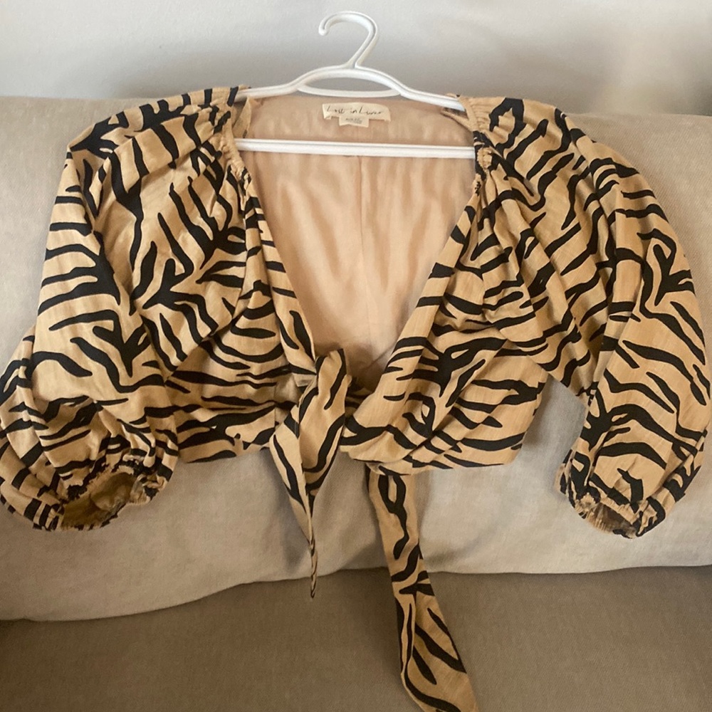 Lost in lunar, tan and black zebra print, size small